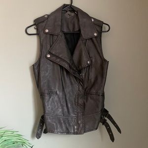 Faux leather vest with belted accents and pockets
